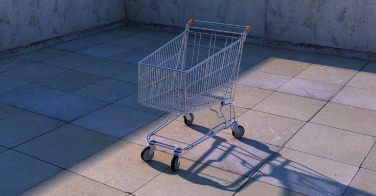 a shopping cart sitting on a tiled floor.