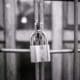 a padlock is attached to a metal gate.