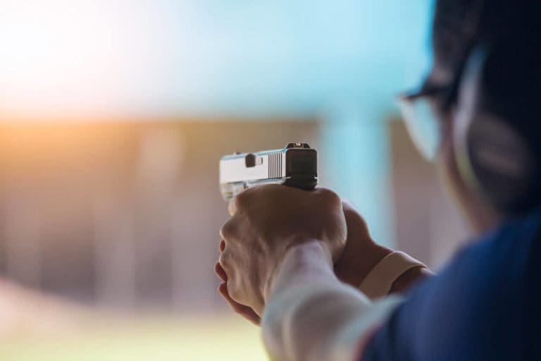 a person holding a camera in their hand.