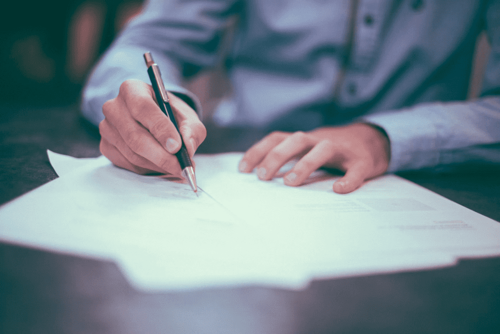 A person fills out a criminal report check in California.