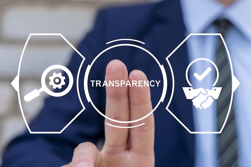 A person touches a screen that says "Transparency" and has two icons to illustrate the concept.