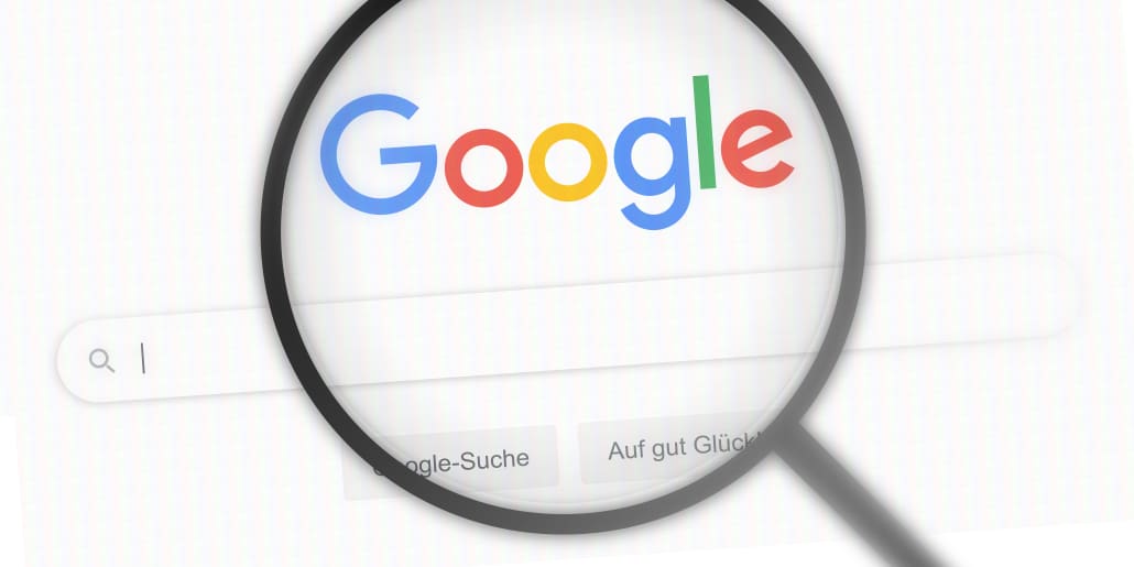 A magnifying glass with a google logo on it.