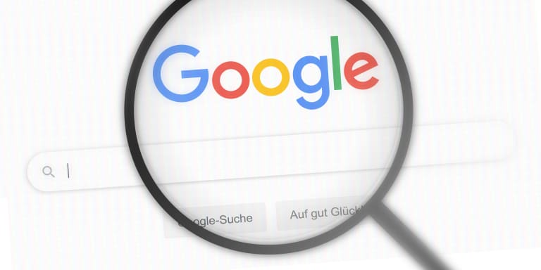 A magnifying glass with a google logo on it.
