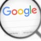 A magnifying glass with a google logo on it.