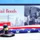 A gavel sits on top of an american flag and the word bail bonds.