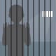 A silhouette of a man in solitary confinement.