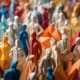 A dense assembly of multicolored origami paper figures, resembling a crowd of people, crafted in various hues and meticulously arranged, focusing on diversity and unity.
